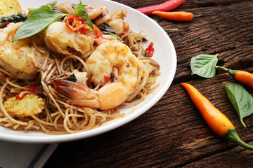 spaghetti seafood on wood table