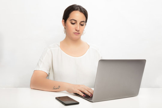 Woman working with concentration on laptop