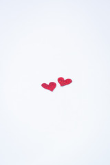 Small handmade red hearts. Isolated. Valentine's or Wedding's day postcard concept.