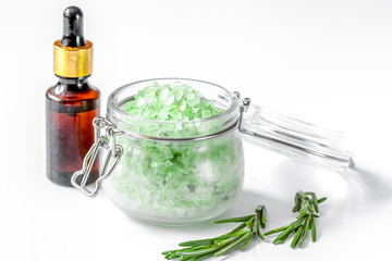 organic cosmetics with extracts of herbs rosemary on white backg