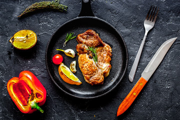 concept cooked steak on dark background top view