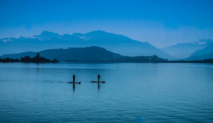 Standup paddleboarding, upper lake Zurich (Obersee) near Rapperswil, Sankt Gallen, Switzerland