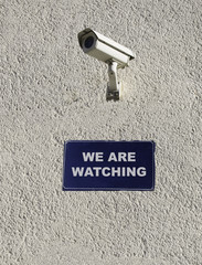 Surveillance concept privacy violation security safety we are watching sign