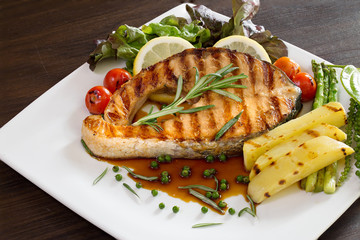 Grill Salmon with Teriyaki sauce and fresh pepper with rosemary in white dish tile flooring