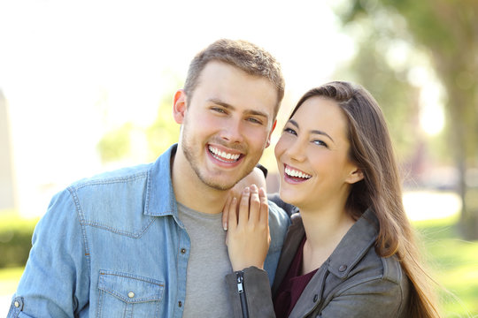 Couple posing with perfect smile and white teeth