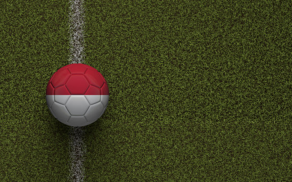 Indonesia flag football on a green soccer pitch. 3D Rendering