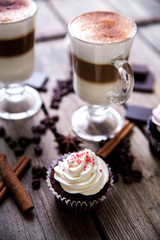 cupcakes decorated with sweet on wooden table