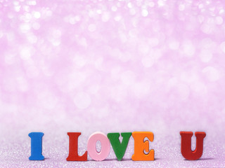 I LOVE YOU text on pink abstract glitter background with bokeh. lights blurry soft pink for the romance background and background copy space for text. Valentines day, love concept and love background
