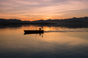 Obraz premium Fishing boat on the waters of the Upper Lake Zurich (Obersee), Hurden, Switzerland