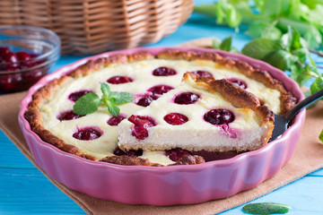 Tasty homemade pie with cherries on table