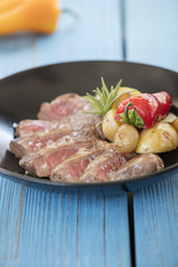 steak on blue background