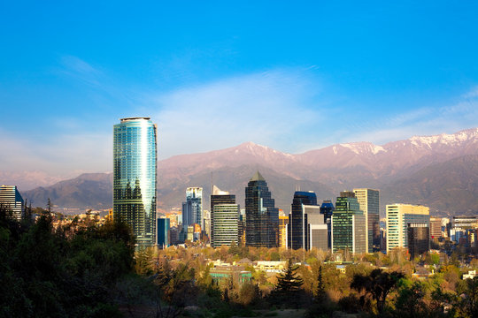 Skyline of Modern buildings in Santiago de Chile with The Andes Mountain Range in the back