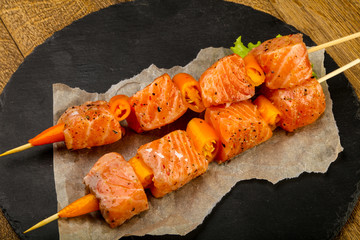 Raw salmon skewer