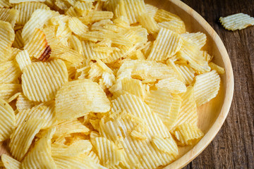 Snacks in a wooden dish on a table