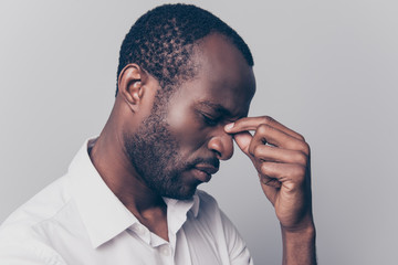 Side profile close up view portrait of nervous stressed depressed unsatisfied hard-working african...