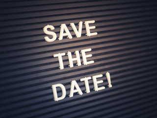 Save the date - letters on a black board