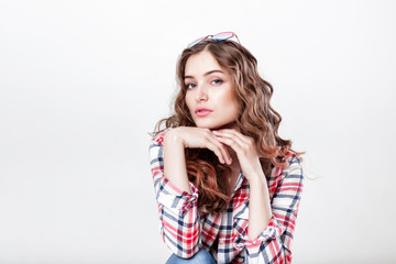 woman in sunglasses and plaid shirt