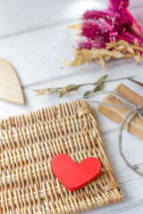 Red heart and gift on craft paper on Valentine's day