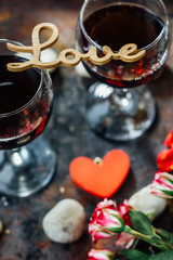 Beautiful letters LOVE on glasses of wine