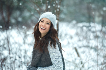 beautiful smiling young woman in wintertime outdoor. Winter concept - 187754743