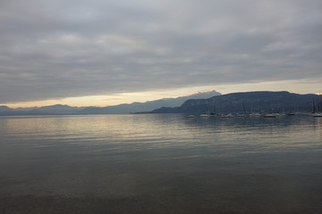 Fototapeta na wymiar Cloudy twilight on Lake Garda, Italy