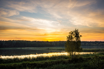 Sunset over the pond in Zalesie Gorne, Poland