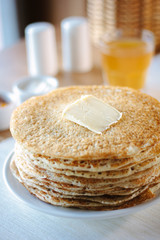 Hip of thin russian pancakes, called blini, at restaurant.