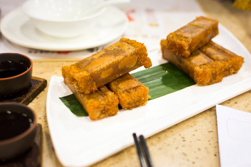 Fried coconut flavor sponge cake served on the table