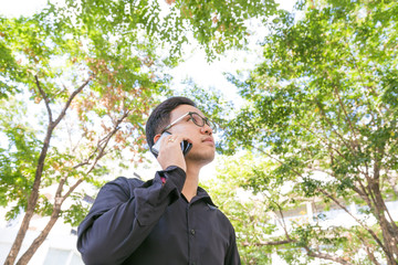 Smart business man use cellphone in park