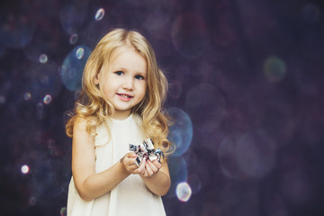 Little girl child cute and beautiful background glare happy happy with confetti