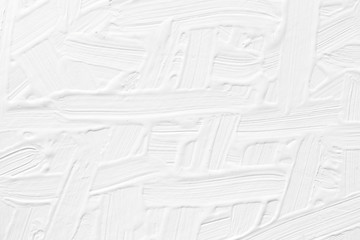 The texture of the paint is white. Plaster on the wall with a volumetric pattern.