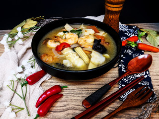 Bowls of Asian soup noodles and vegetables with Chopstick