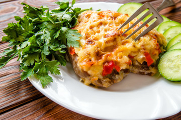 Pork chop with cheese and red pepper 