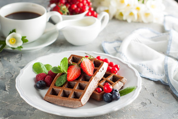 Homemade chocolate waffles with berries