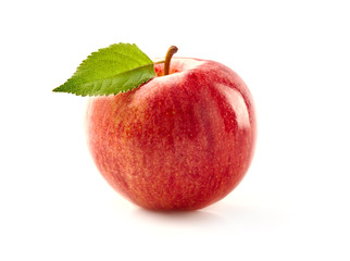 Red apple with leaves on white background