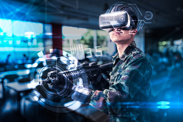 The abstract image of the soldier use a VR glasses for combat simulation training overlay with the...
