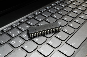 Microchip lying on computer keyboard