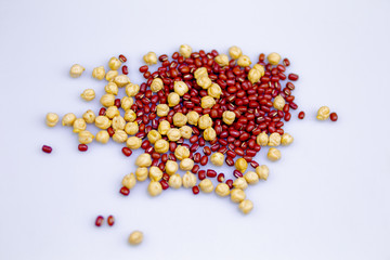Heap of adzuki beans and chickpeas on grey background