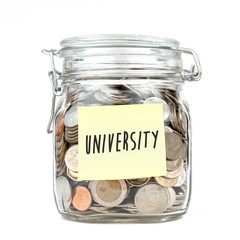 Stack of Thai Baht coins in saving money box with word "UNIVERSITY" on yellow sticky note paper isolated on white background, front view.