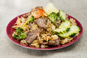 Homemade Chinese fried rice with vegetables and fried eggs