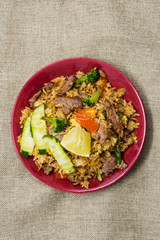 Homemade Chinese fried rice with vegetables and fried eggs