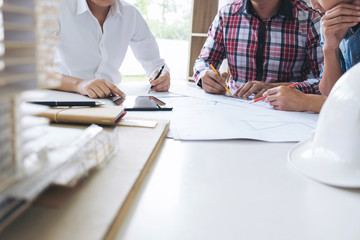 Architect working on blueprint, Engineer meeting working with partner colleagues and engineering tools for architectural project, Construction concept