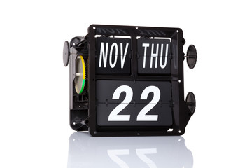 The mechanical calendar retro date 22 November, 2018 on isolated Thanksgiving Day.