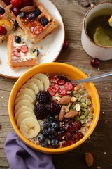 oatmeal breakfast with fruits and waffles