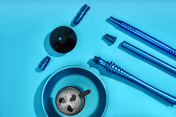 Top view of Hookah parts on light blue background
