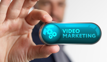 The concept of business, technology, the Internet and the network. A young entrepreneur working on a virtual screen of the future and sees the inscription: Video marketing
