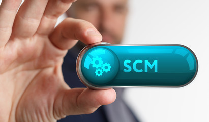 The concept of business, technology, the Internet and the network. A young entrepreneur working on a virtual screen of the future and sees the inscription: SCM