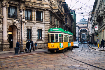 Yellow tram in the historical center of Milan, Italy