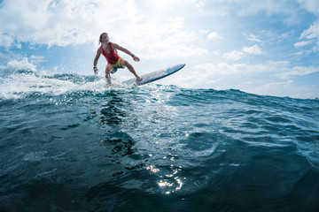 Surfer rides the ocean wave