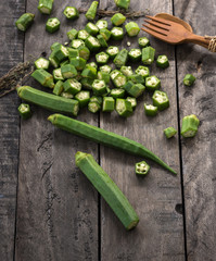 Green Okra on wood